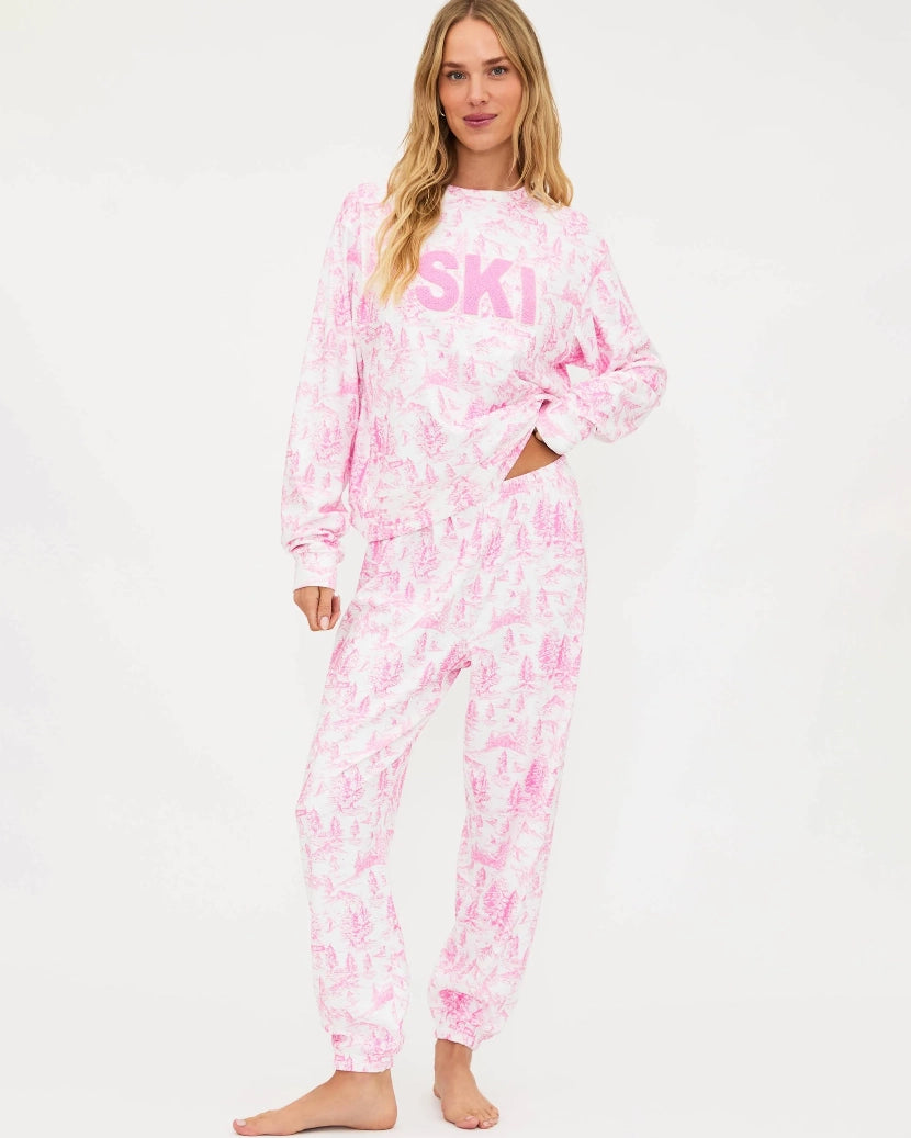 Woman wearing a pink and white toile floral outfit