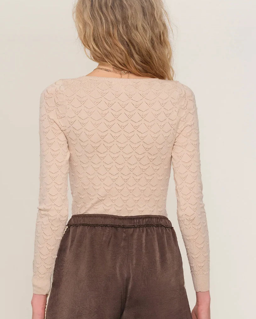 brown satin short with a cream trim on the side