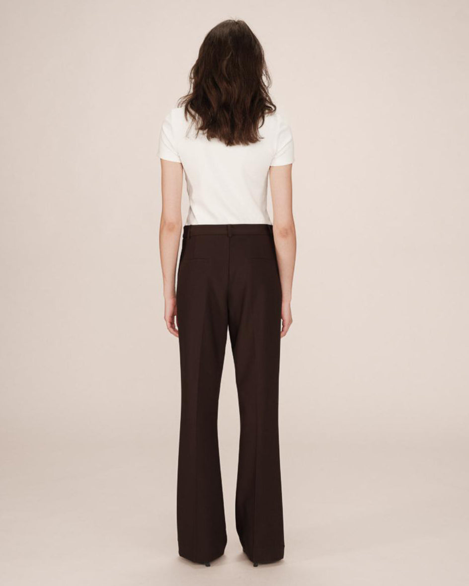 woman wearing brown tailored wide leg pants and white tee