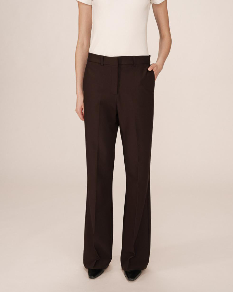 woman wearing brown tailored wide leg pants