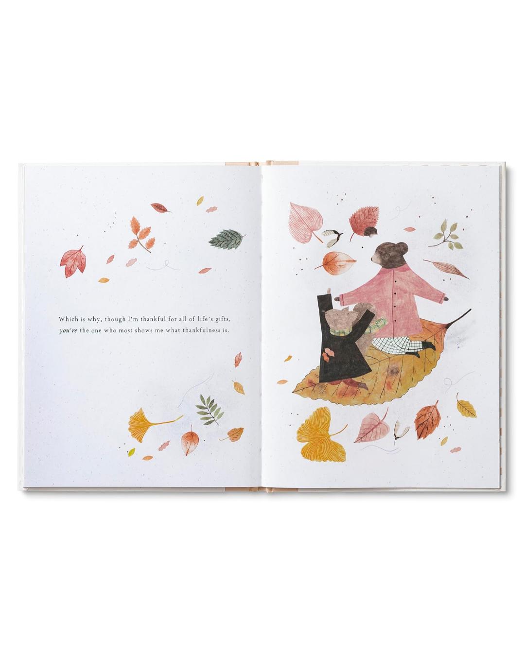 Open book with illustrated pages featuring autumn leaves and characters.