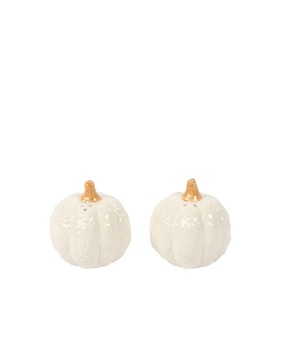 salt and pepper shaker in the shape of a pumpkin in white with an orange stem