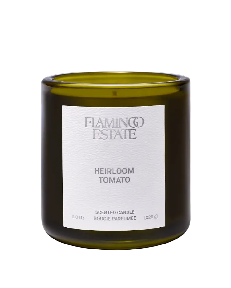 candle in green glass container