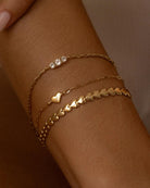 gold herringbone bracelet in the shape of hearts