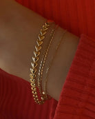 gold herringbone bracelet in the shape of hearts