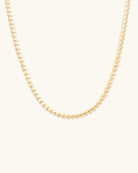 gold herring bone necklace in the shape of hearts