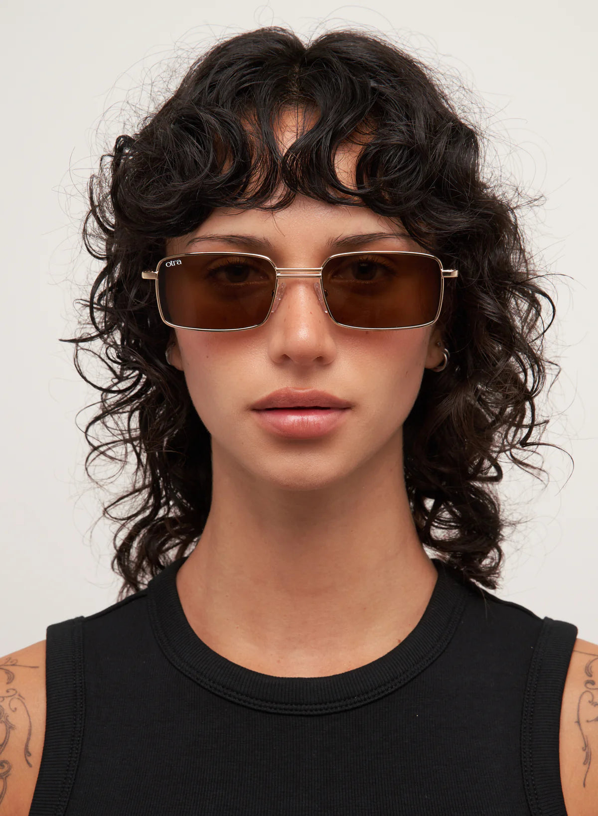 rectangular sunglasses with a gold frame and brown lenses
