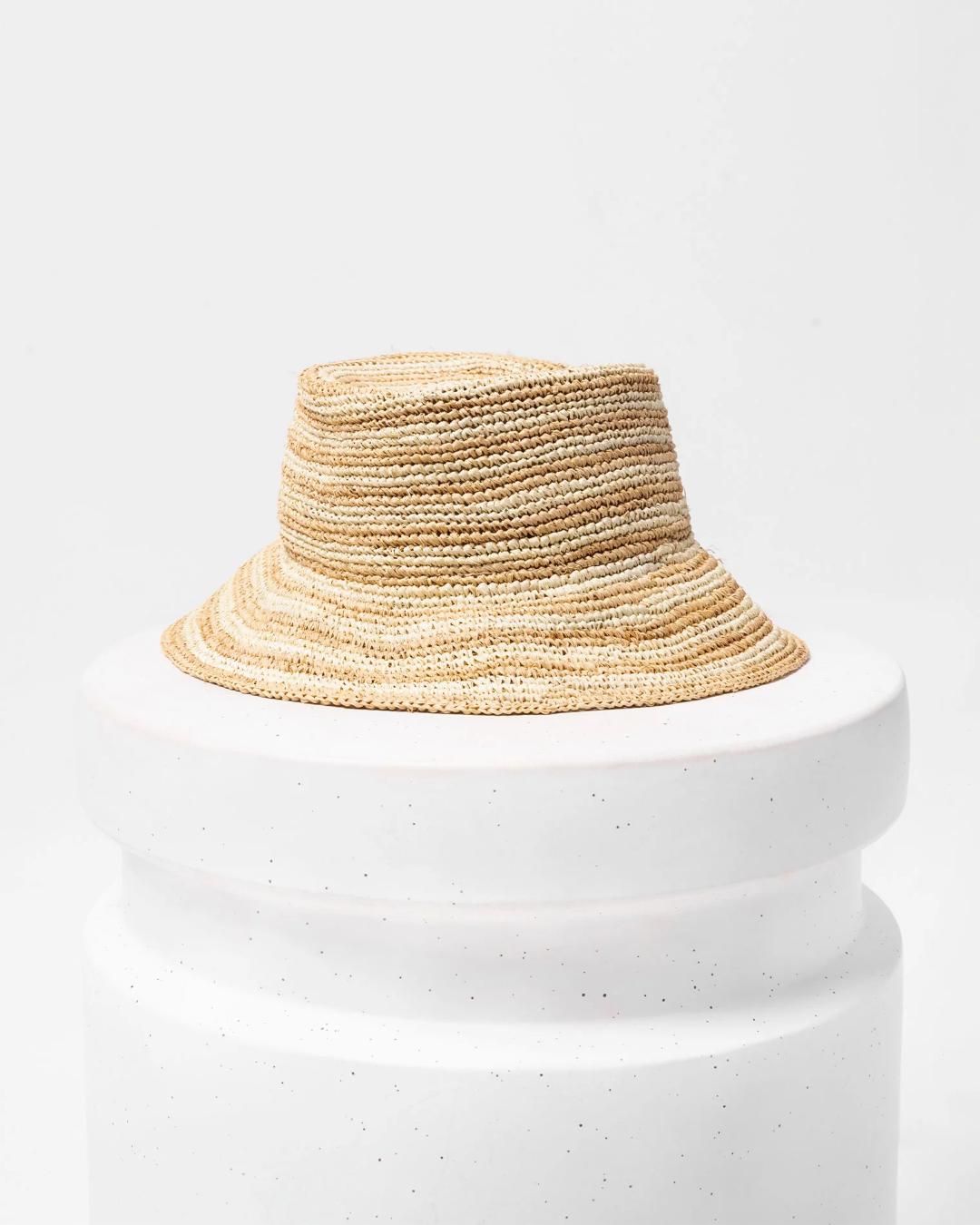 straw bucket hat with a dark beige and light beige stripe