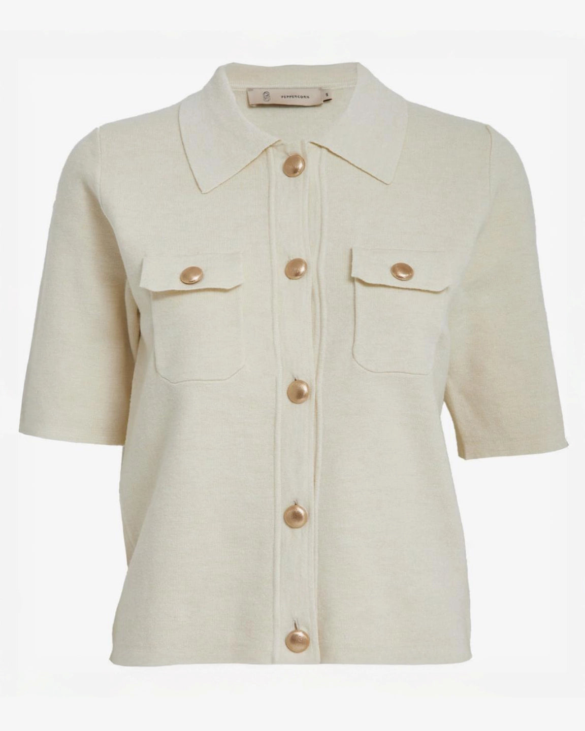 a cream short sleeve shirt with gold buttons