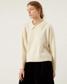 cream sweater with a collar