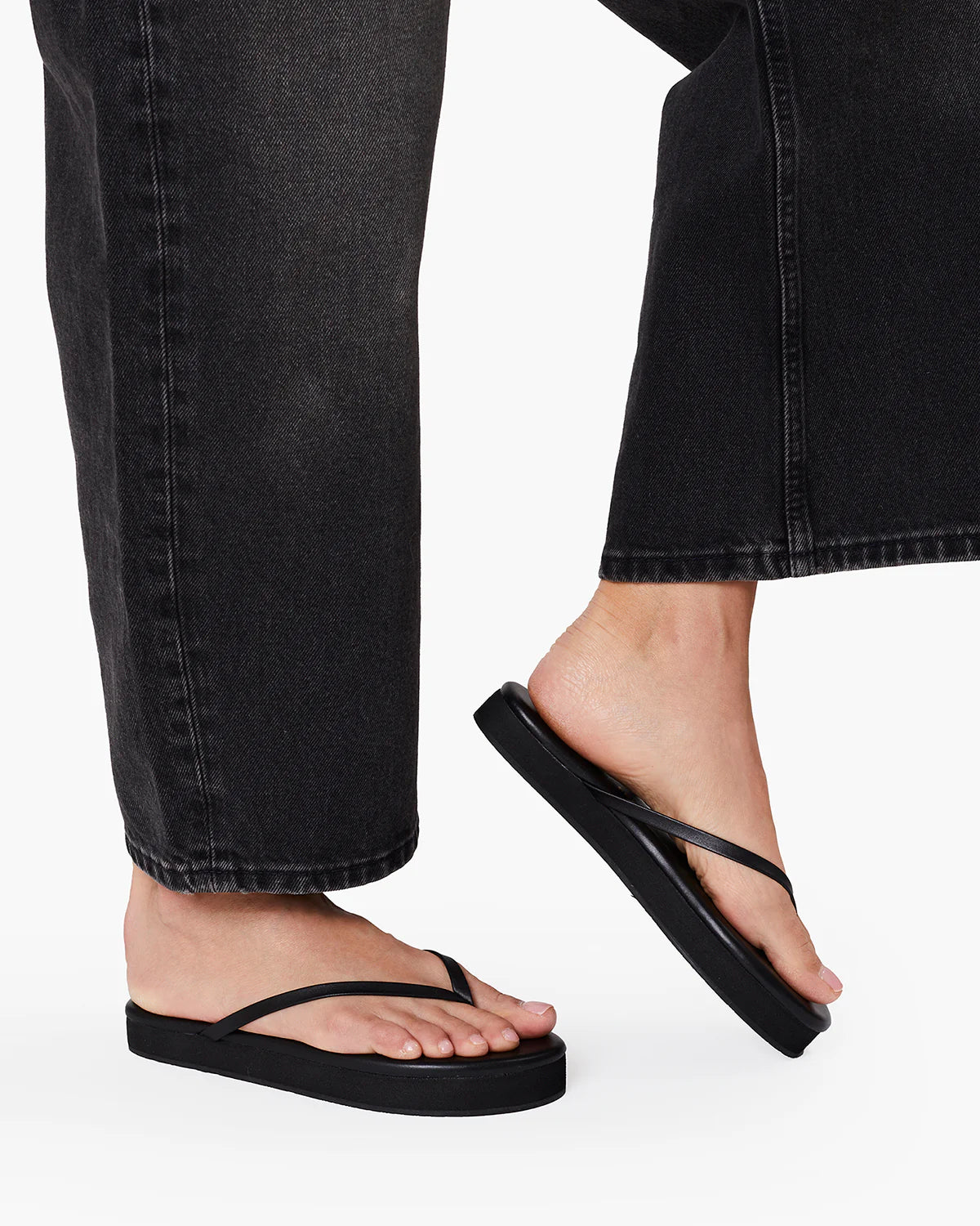 black flip flop with a platform