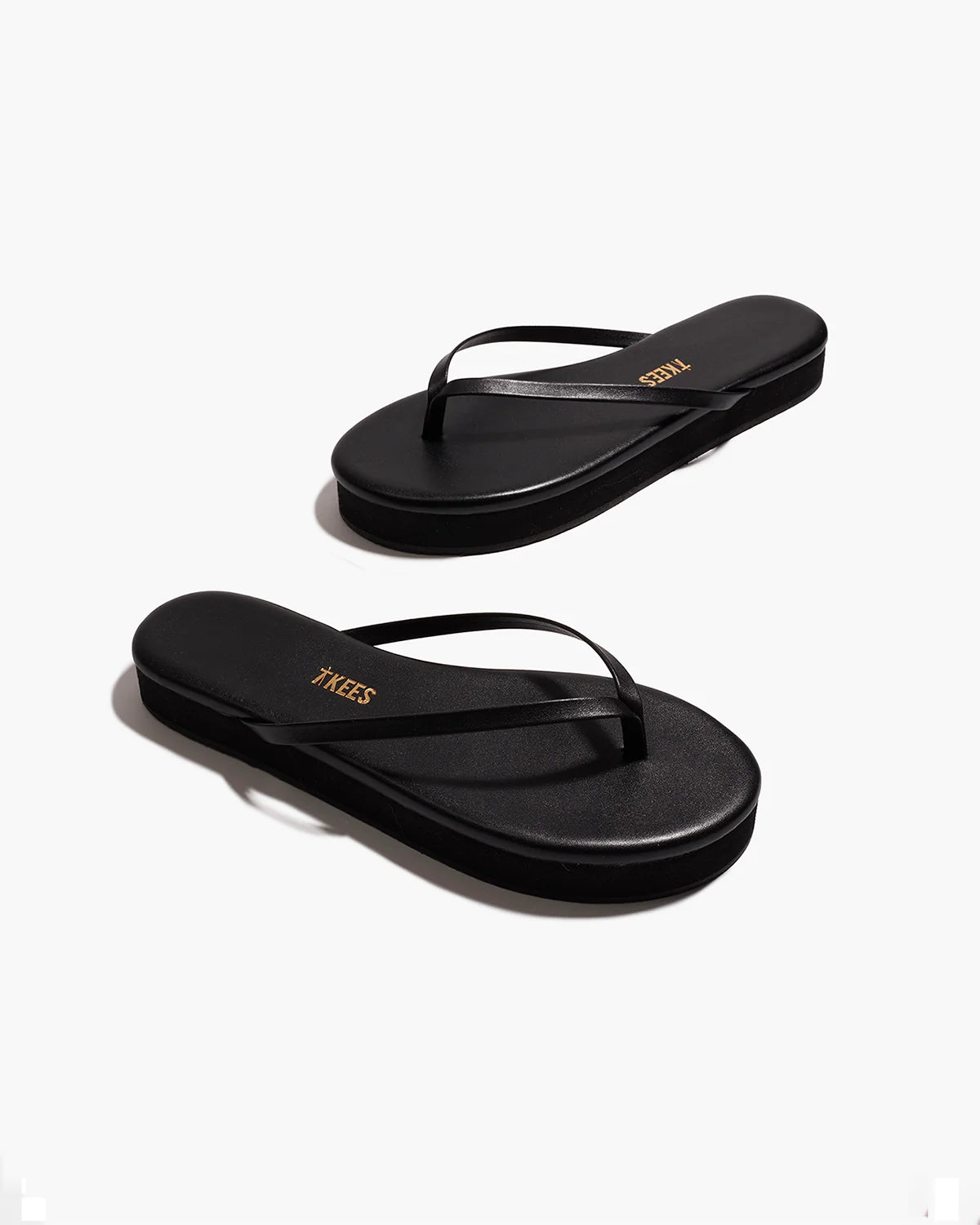black flip flop with a platform