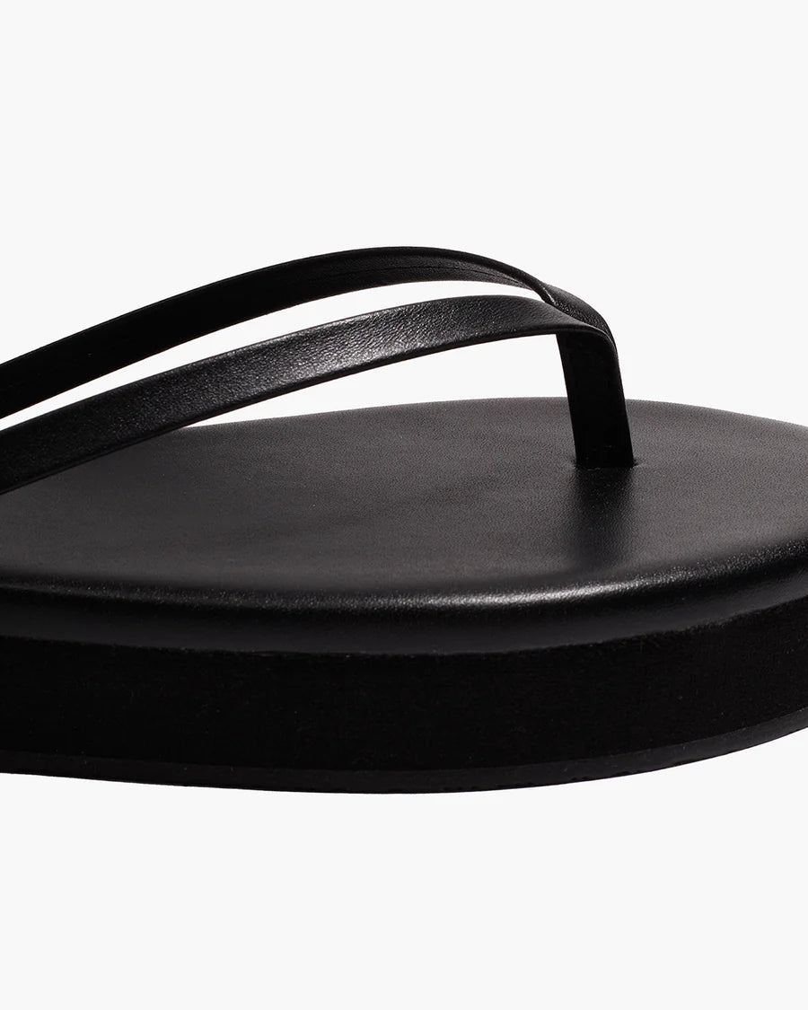 black flip flop with a platform