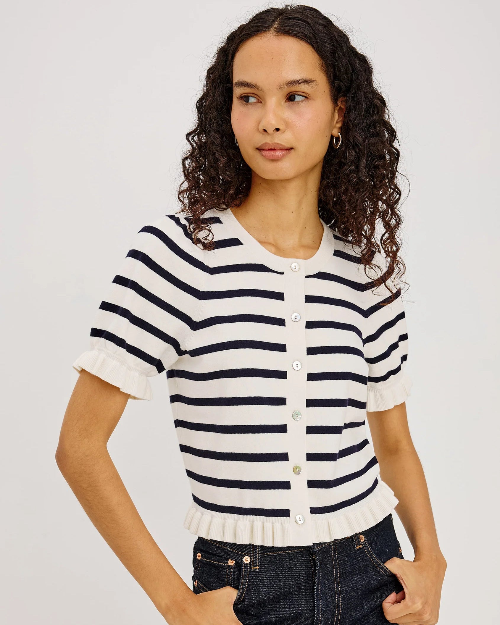 short sleeve sweater with white and navy stripes and a ruffle on the bottom of skirt and sleeves