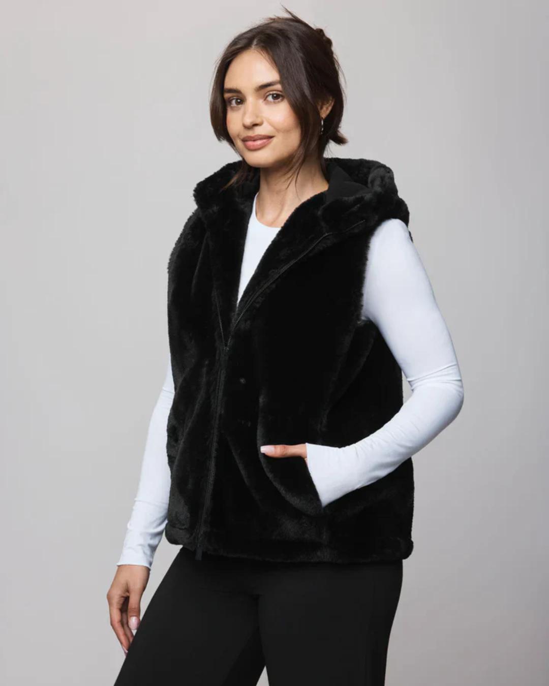 fur vest in black with a hood