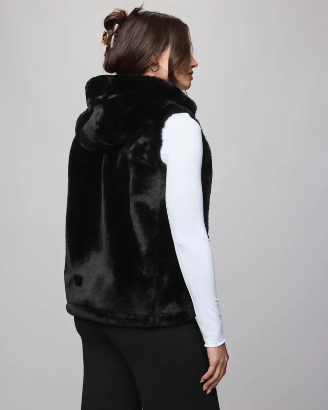 fur vest in black with a hood