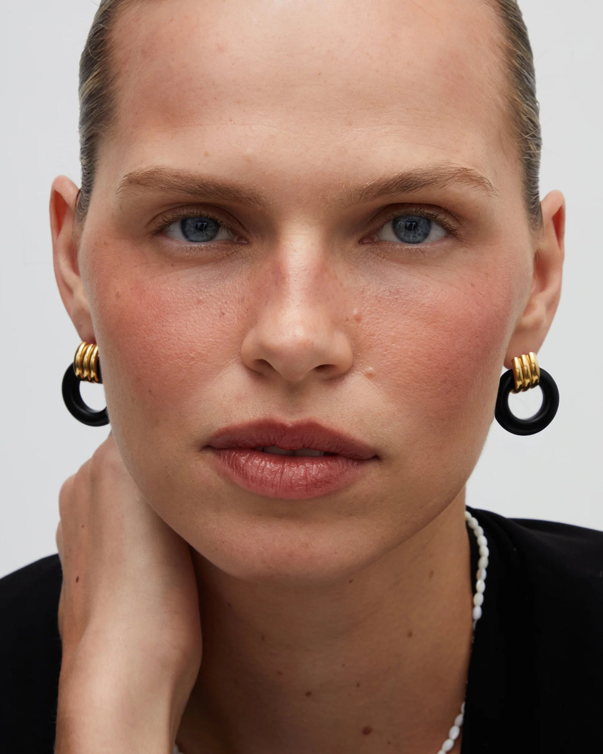 knot earrings in gold and black