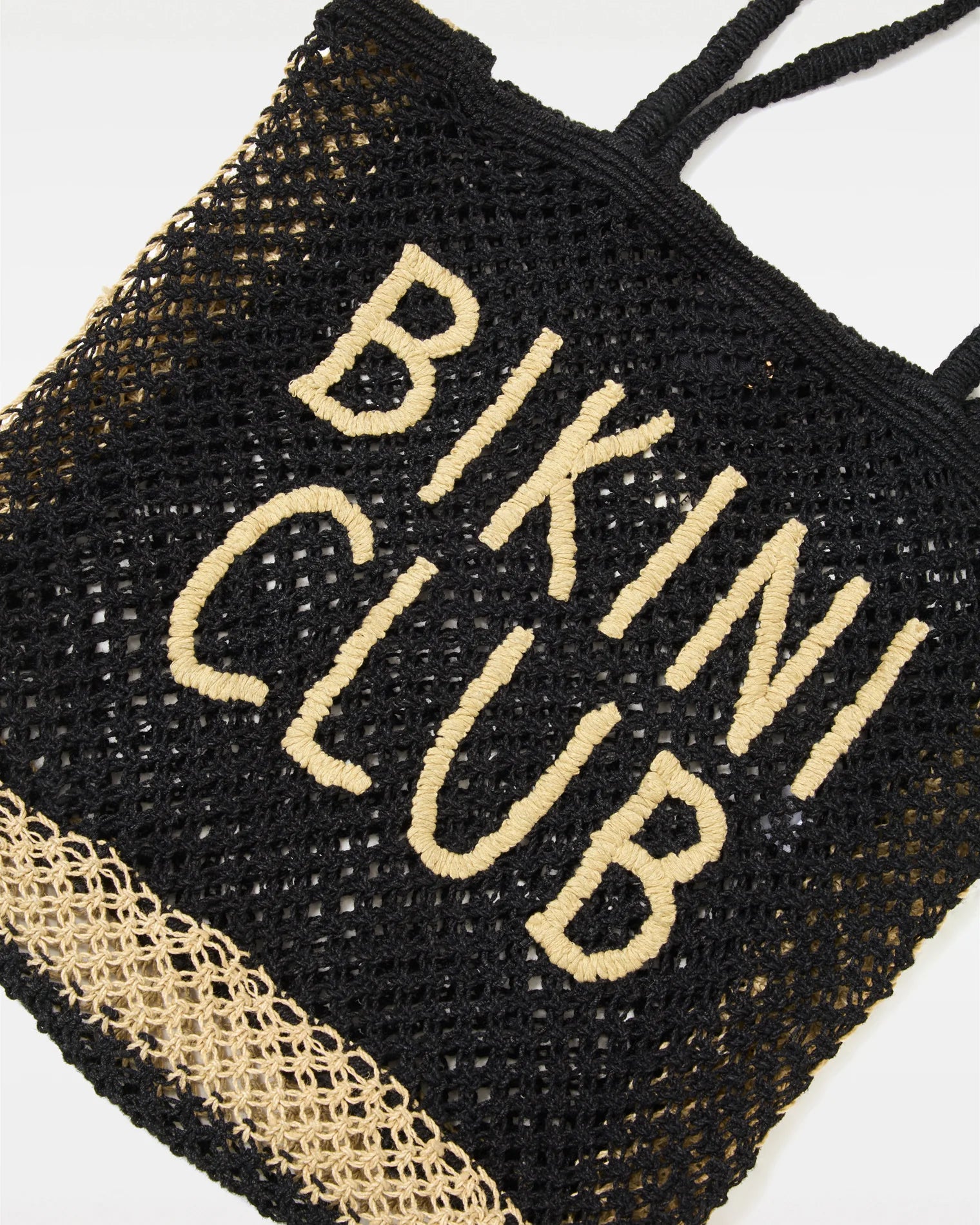 beach bag in cream and black with text beach club