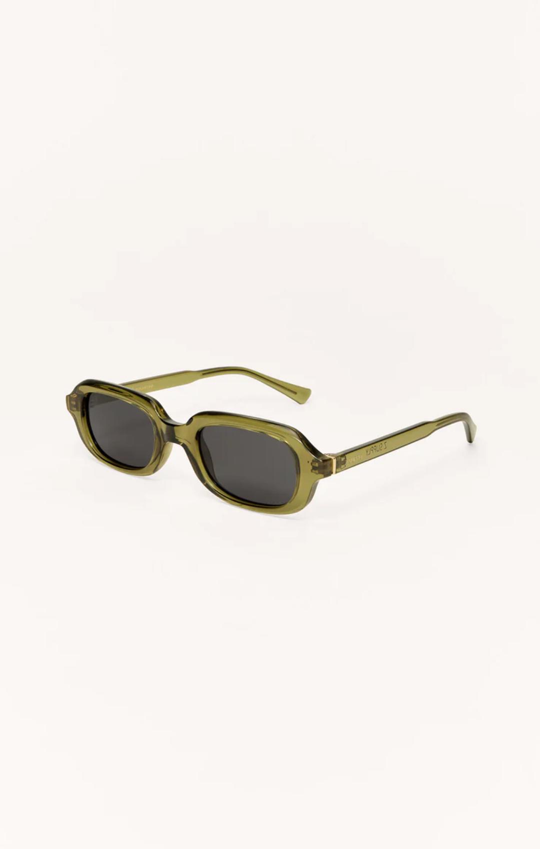 Green sunglasses with dark lenses