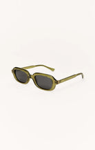 Green sunglasses with dark lenses