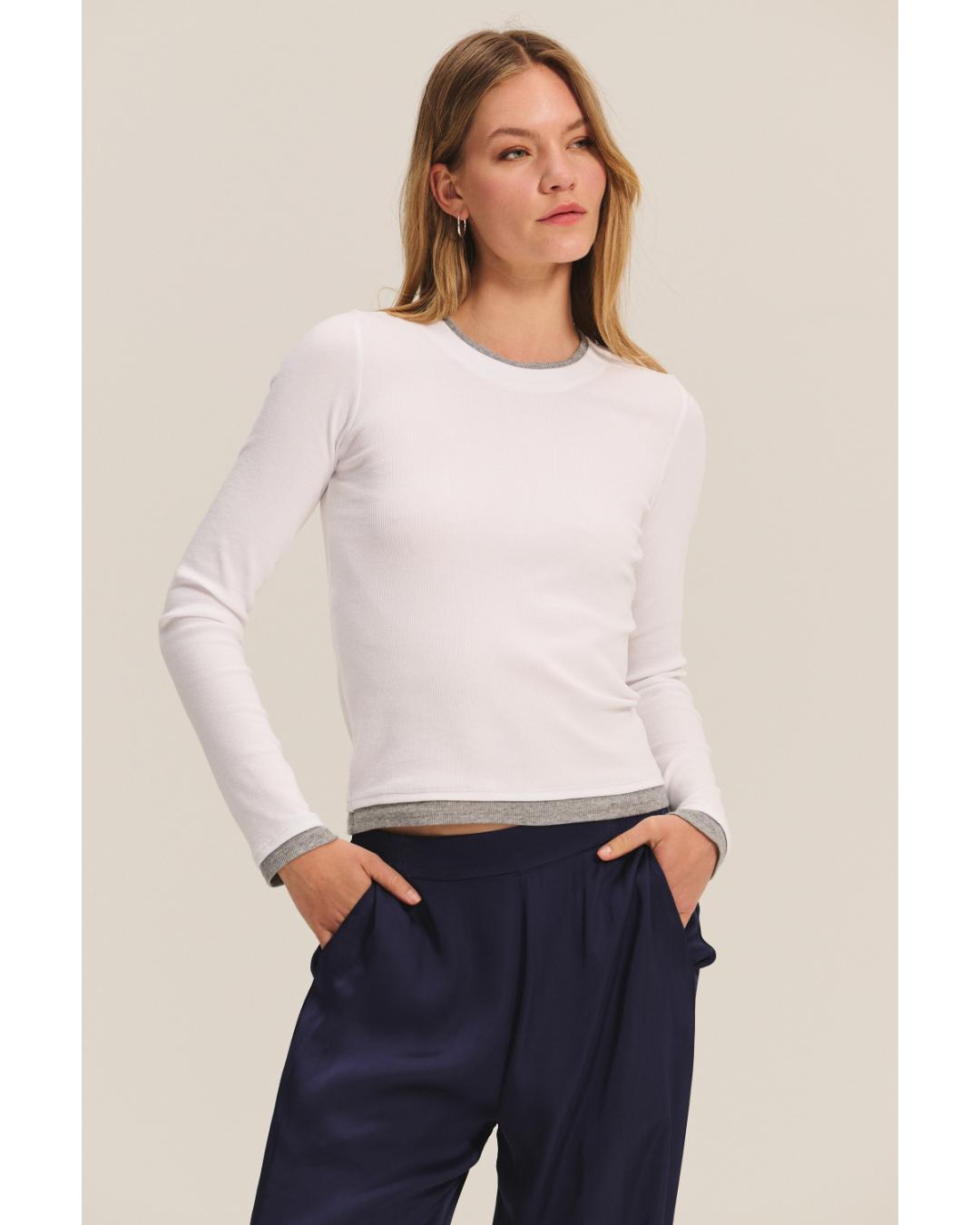 long sleeve shirt in white with grey on bottom and sleeves