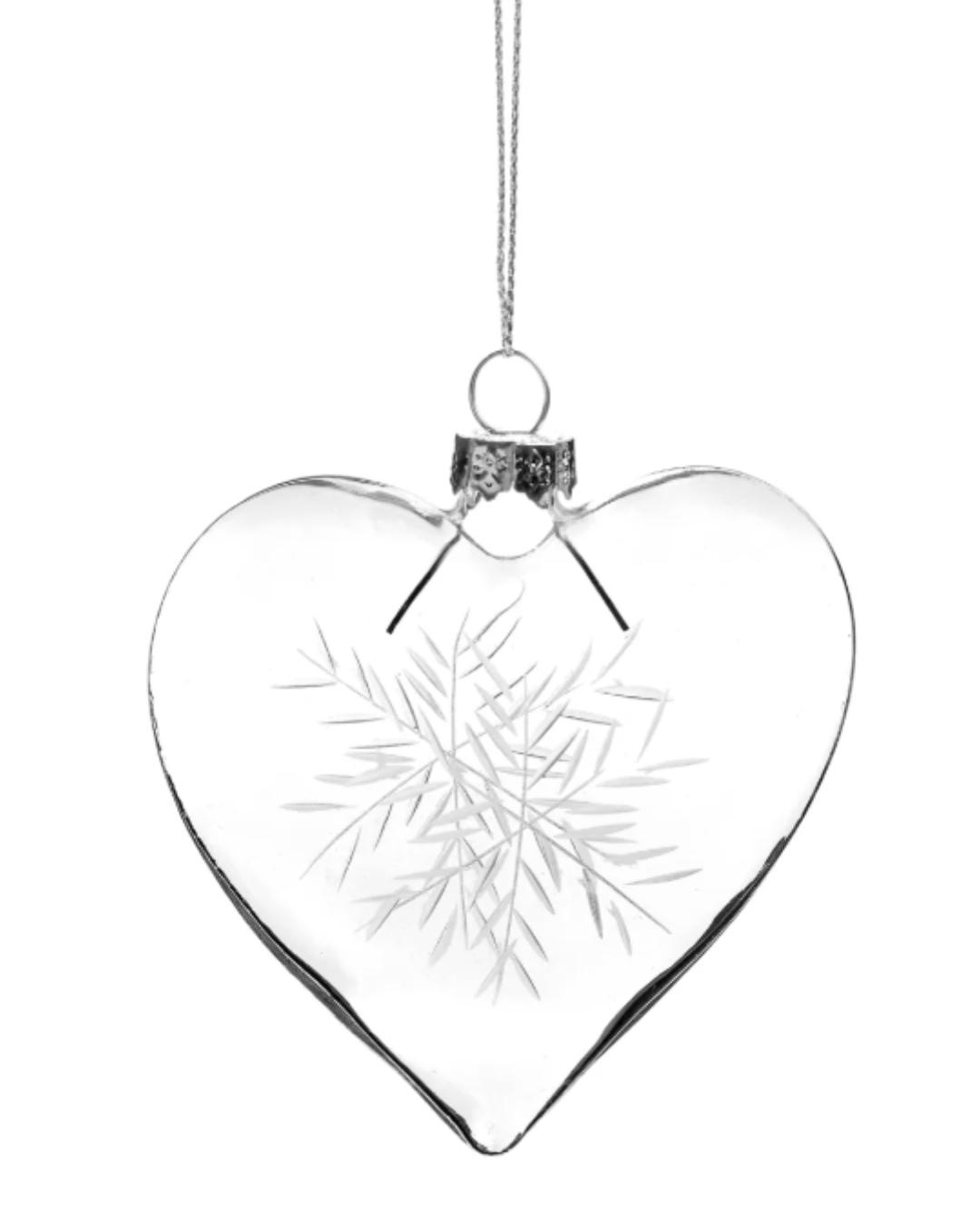 heart shaped glass ornament with a snowflake on it