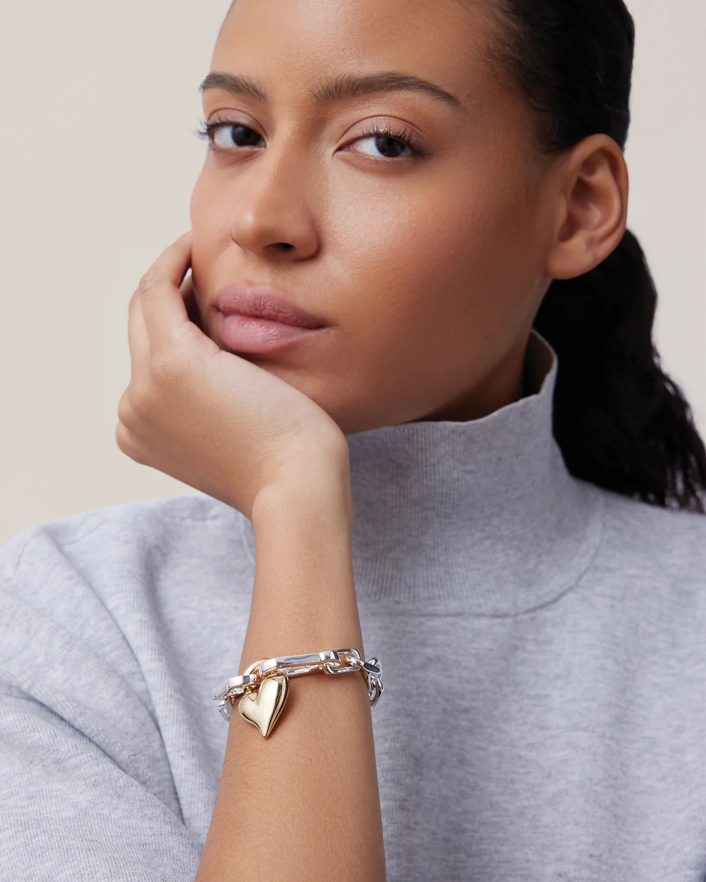 two toned statement chain link bracelet with a heart pendant