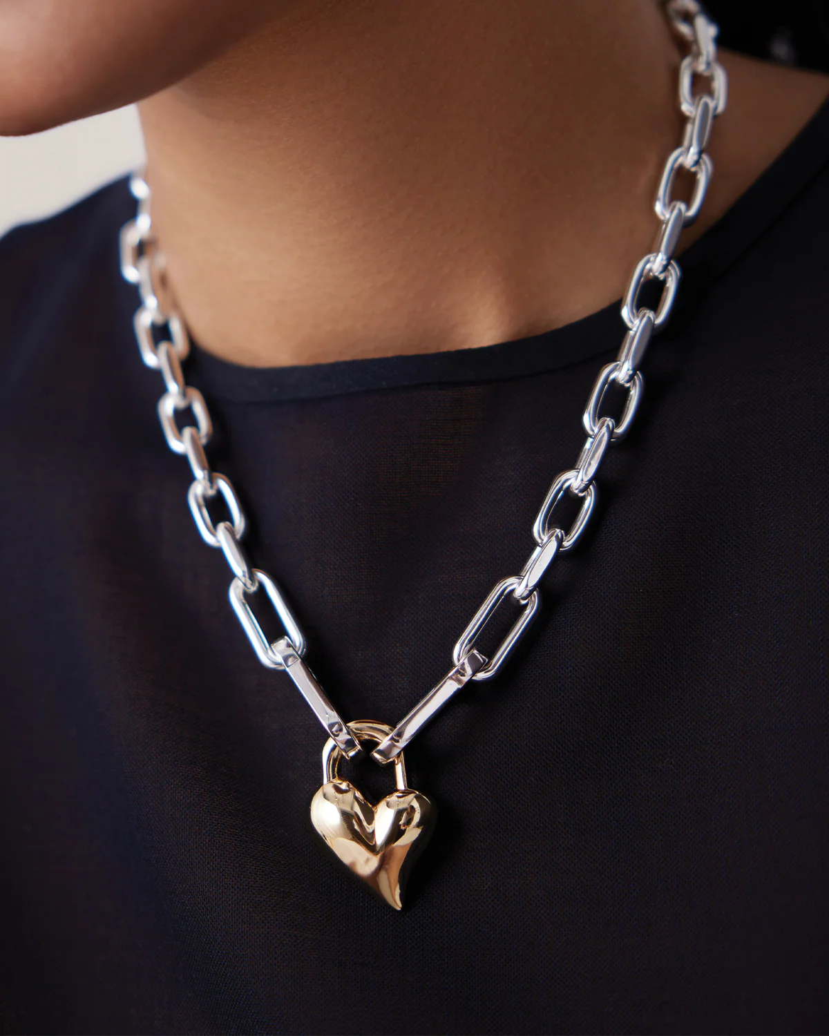 two tone statement link necklace with heart pendant