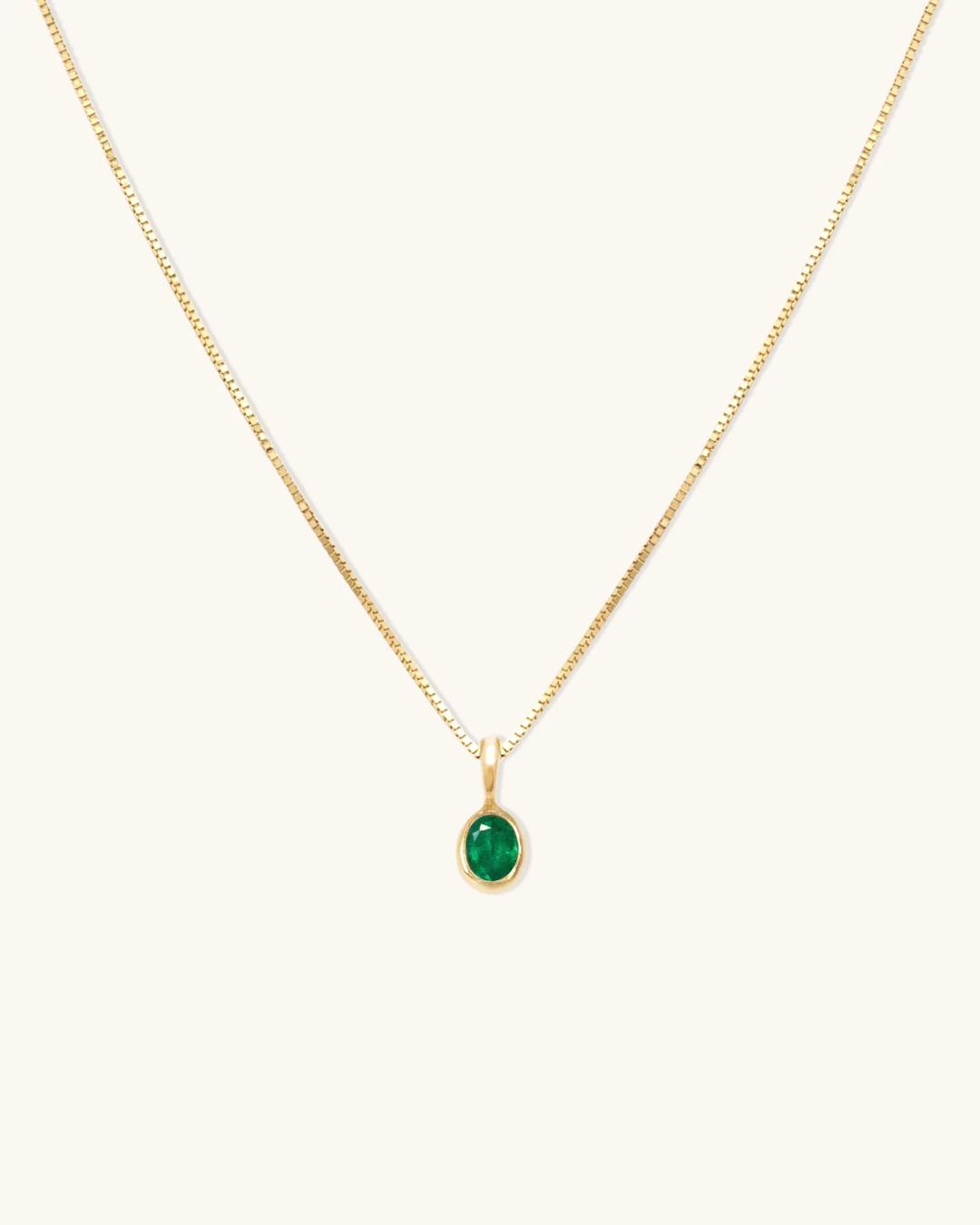 emerald necklace on a gold chain