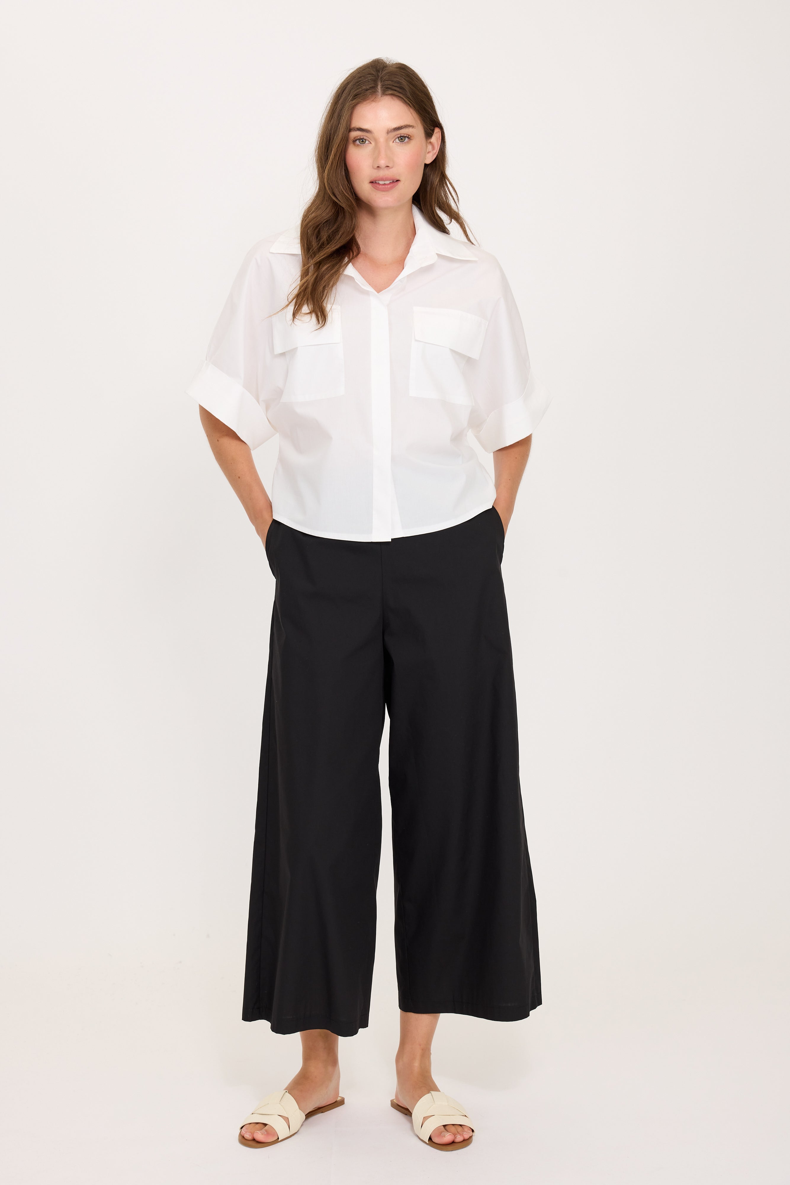 white crop blouse with pockets on the chest and short sleeves