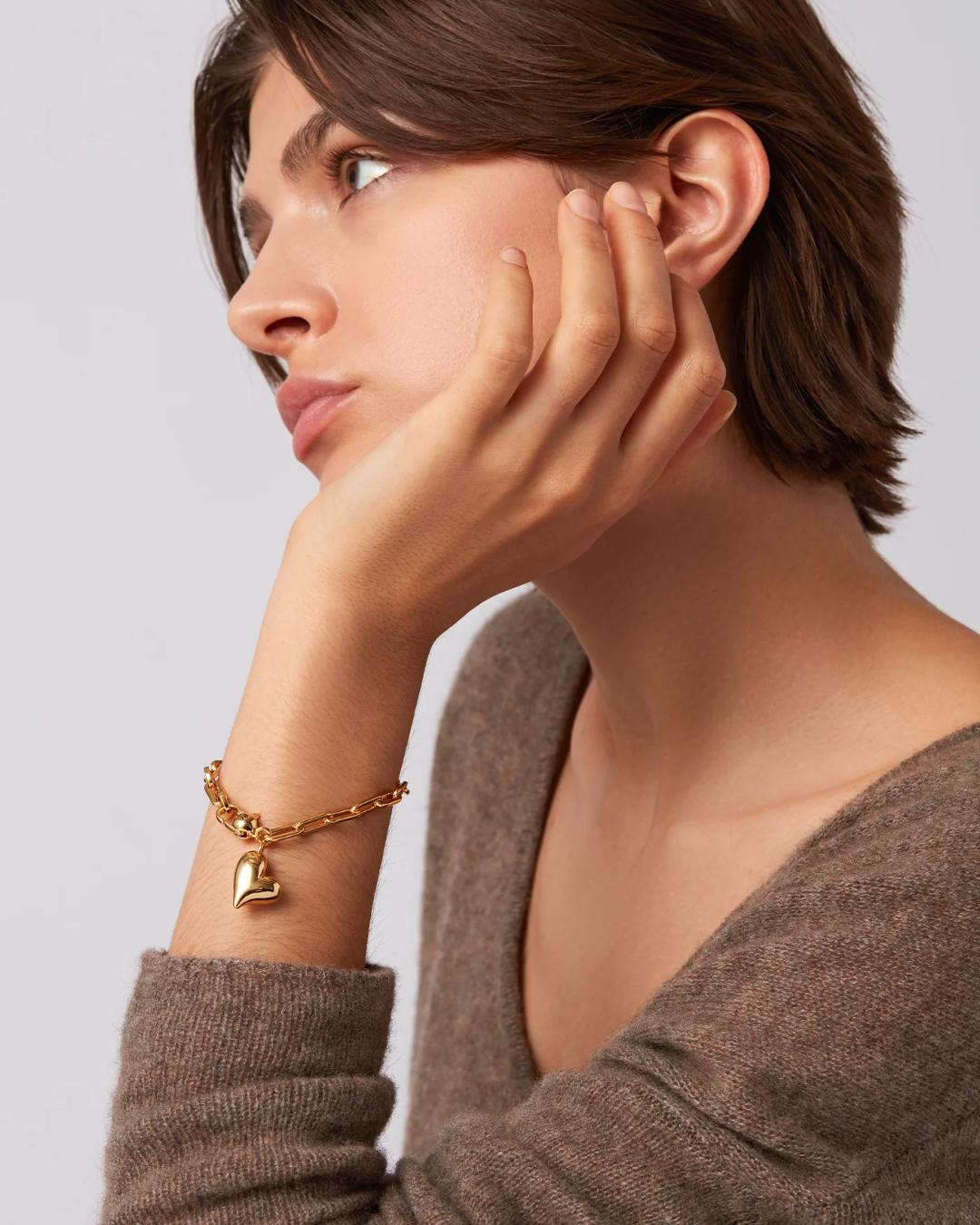 jenny bird link bracelet with heart pendant in gold