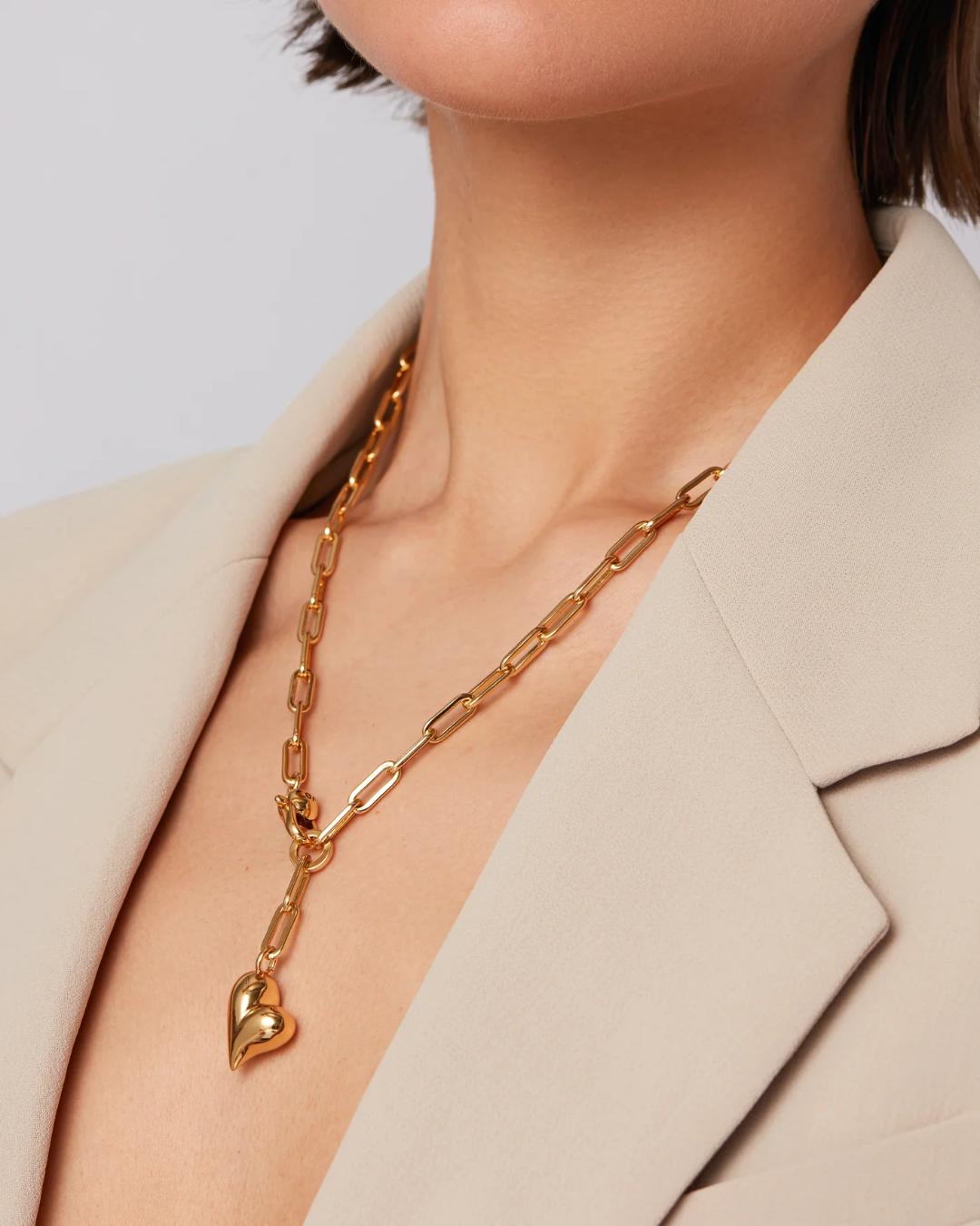 jenny bird statement link necklace with a heart pendant in gold