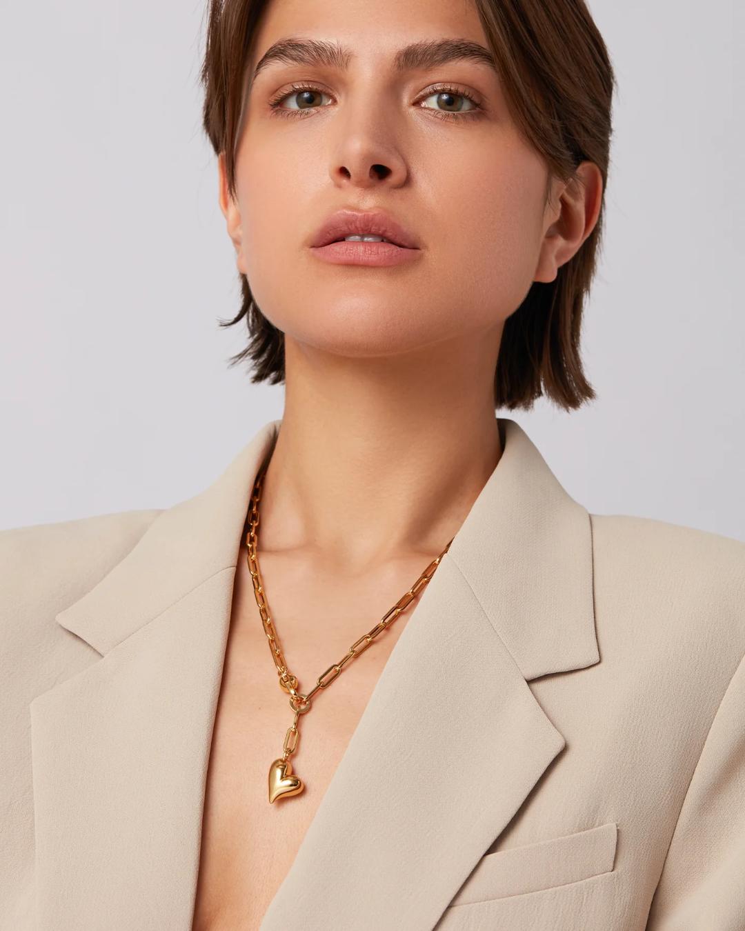 jenny bird statement link necklace with a heart pendant in gold