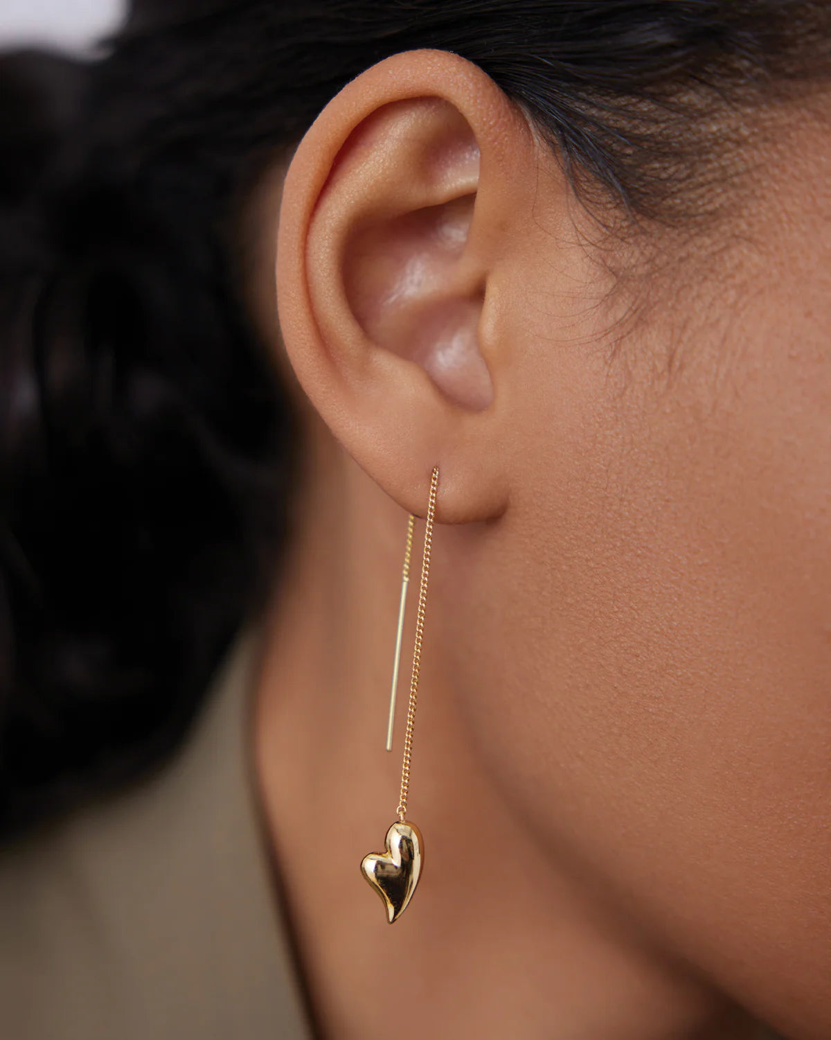 gold threader earrings with heart on bottom