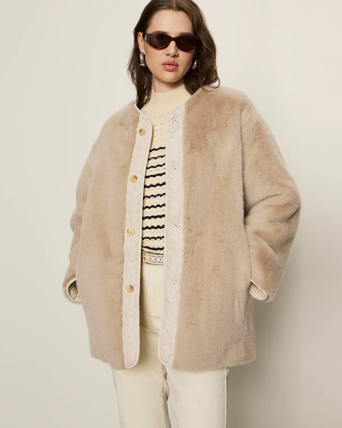 beige coloured fur coat