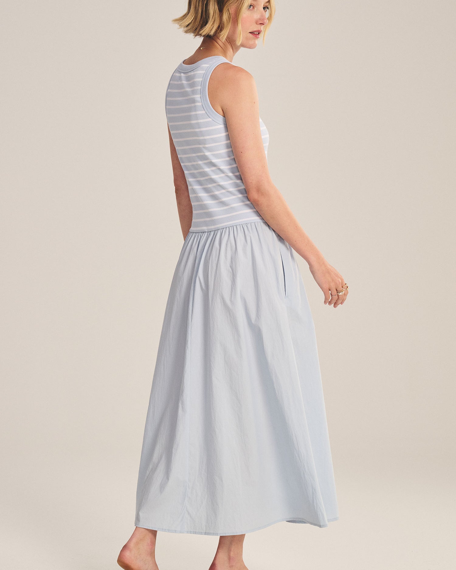 blue midi dress with a striped top and flowy bottom