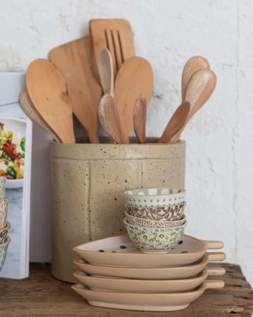 Set of small ceramic pinch bowls and wooden utensils