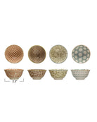 Set of six ceramic bowls with different patterns on a white background