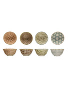 Set of eight ceramic bowls with various patterns on a white background