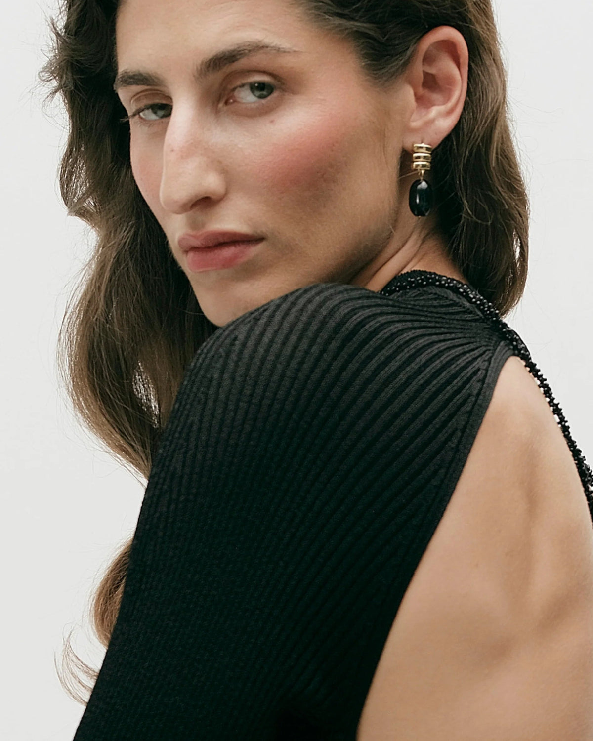 gold drop earring with black stone