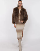 Woman wearing a brown fluffy faux fur jacket