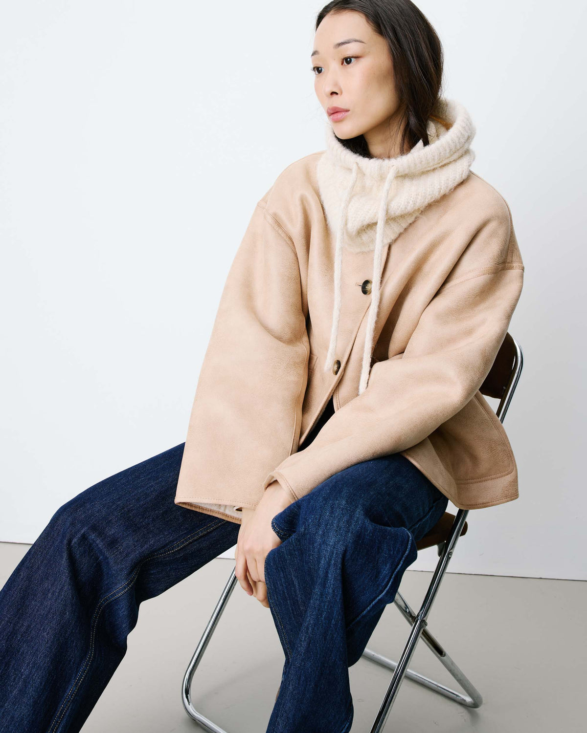 beige knit balaclava with a tie