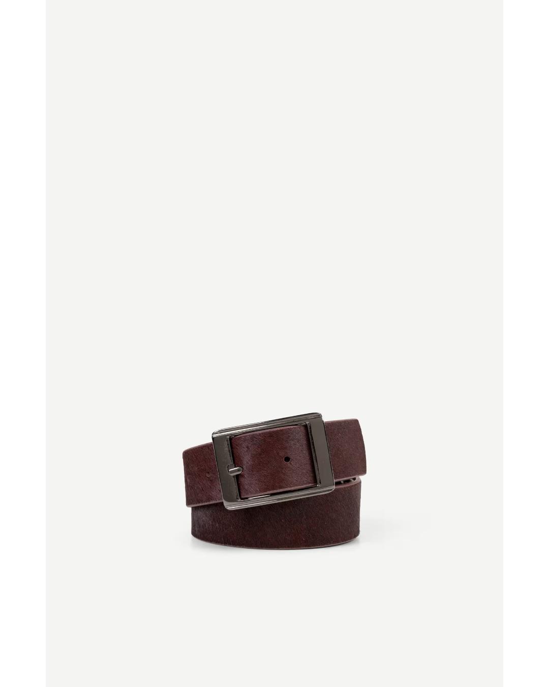 brown leather belt with cow hair and with a silver buckle