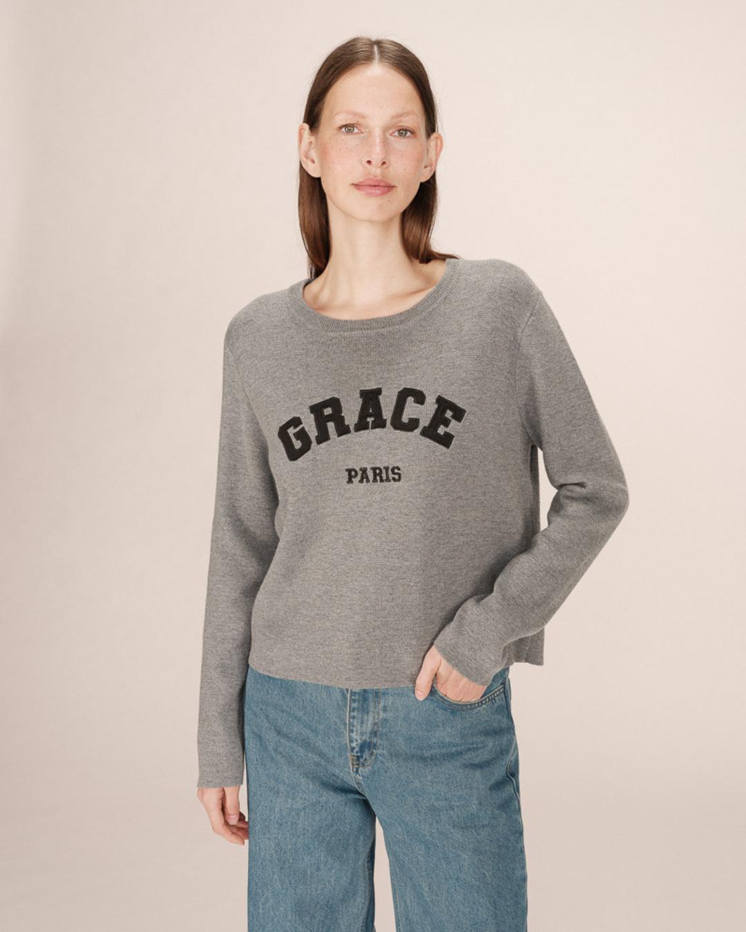 grey crewneck with grace paris written on the chest