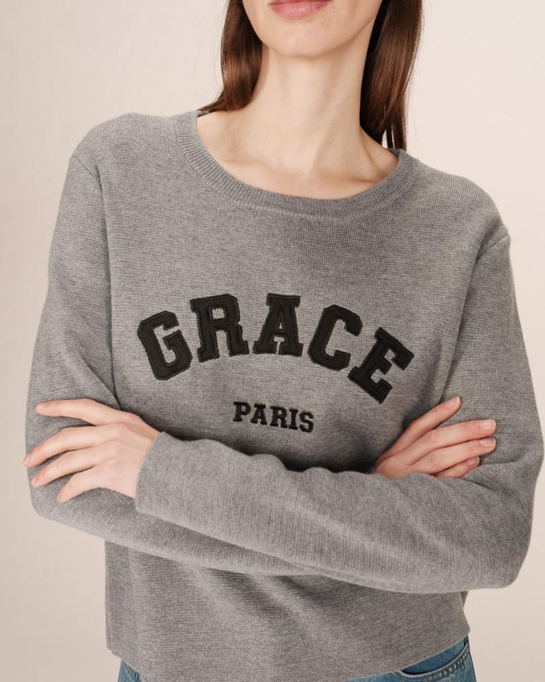 grey crewneck with grace paris written on the chest
