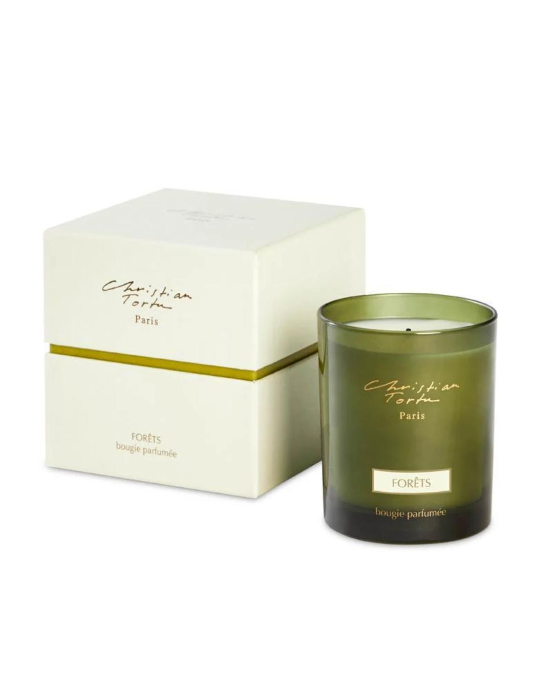 green candle with a box beside it