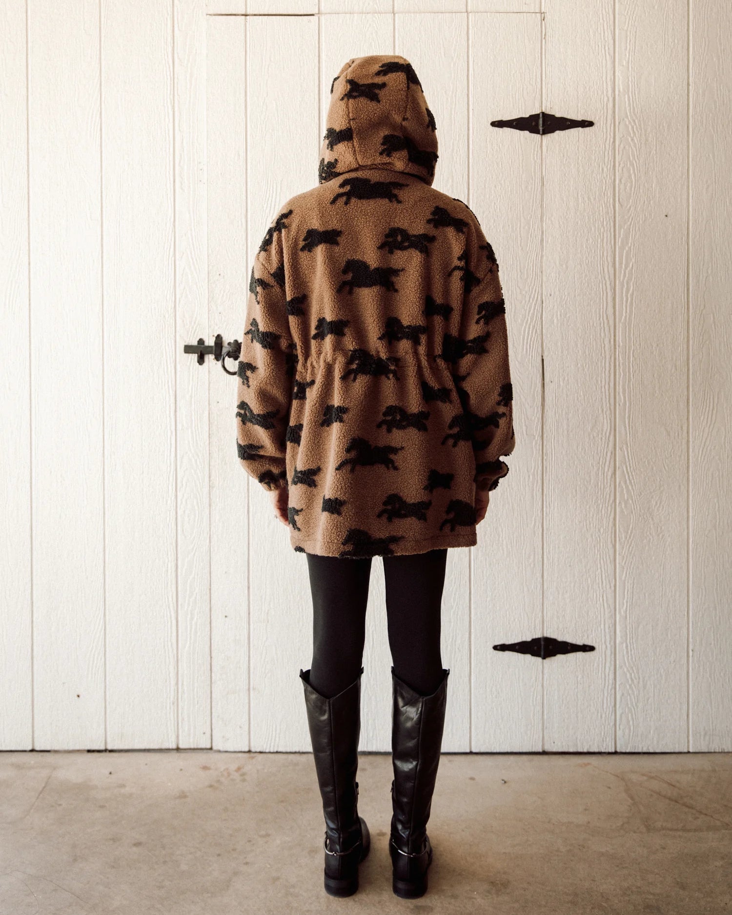 brown parka jacket with brow horses