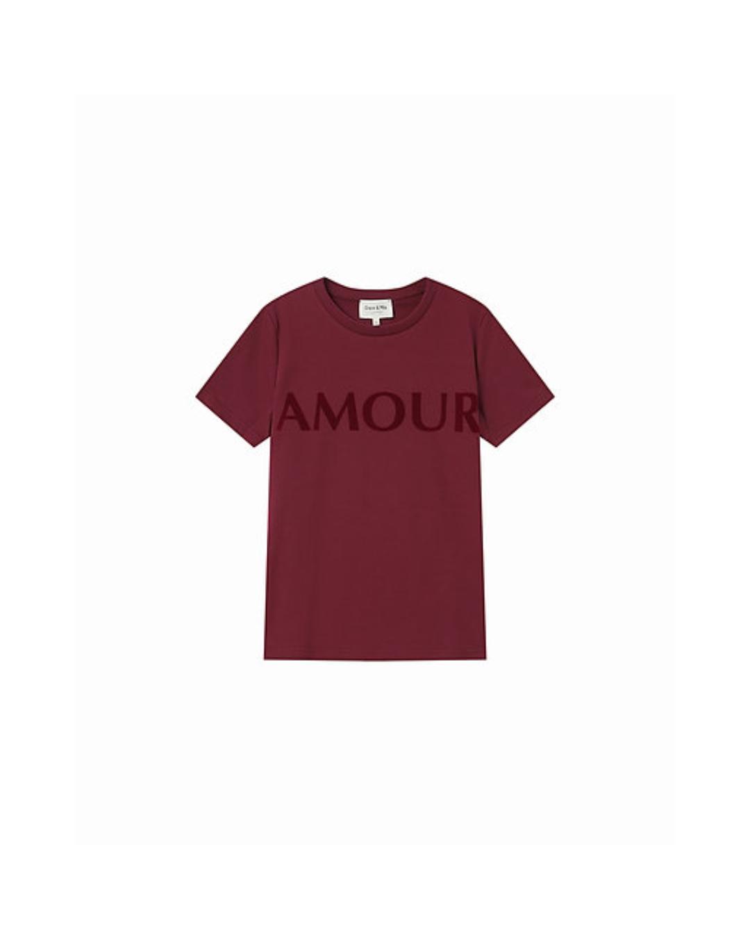 red t-shirt with amour written across the chest