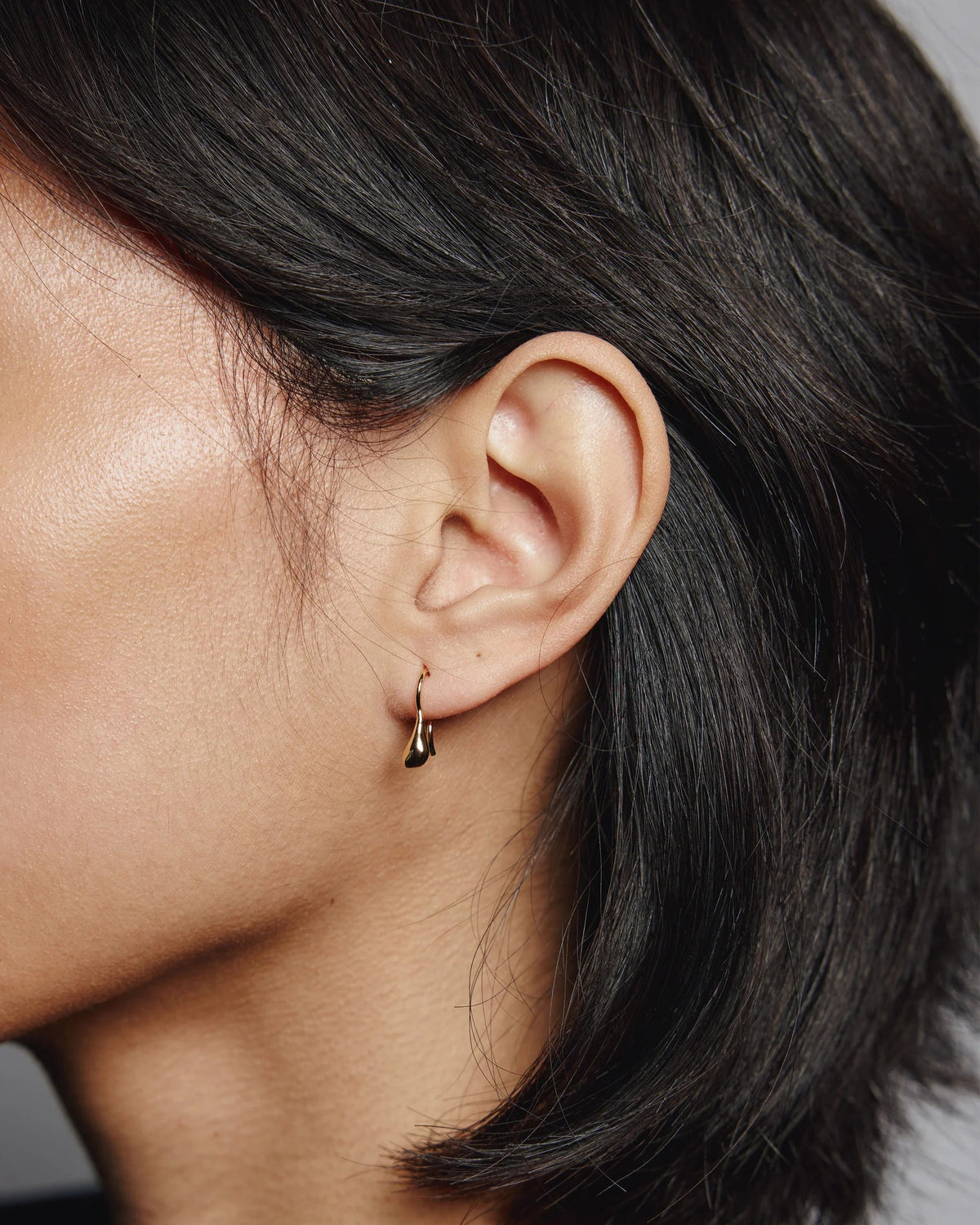 gold bean shaped drop earring