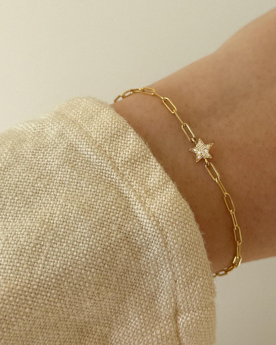gold chain link bracelet with a star